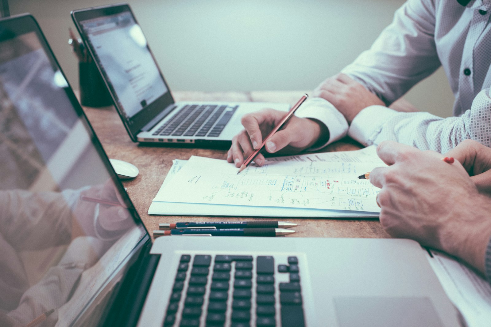 Person reviewing documents at a desk